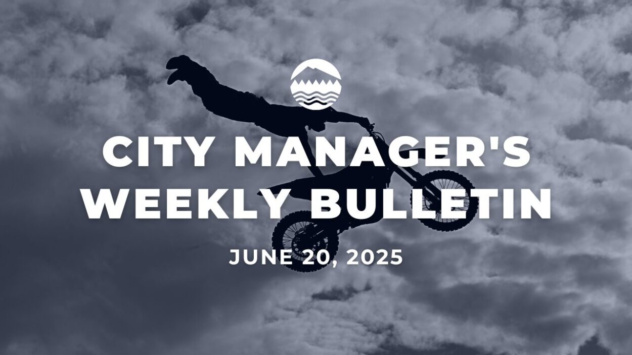 Black and white shot of a motocross rider performing a stunt in the sky against white clouds. White text reads City Manager's Weekly Bulletin June 20, 2025 over the image.