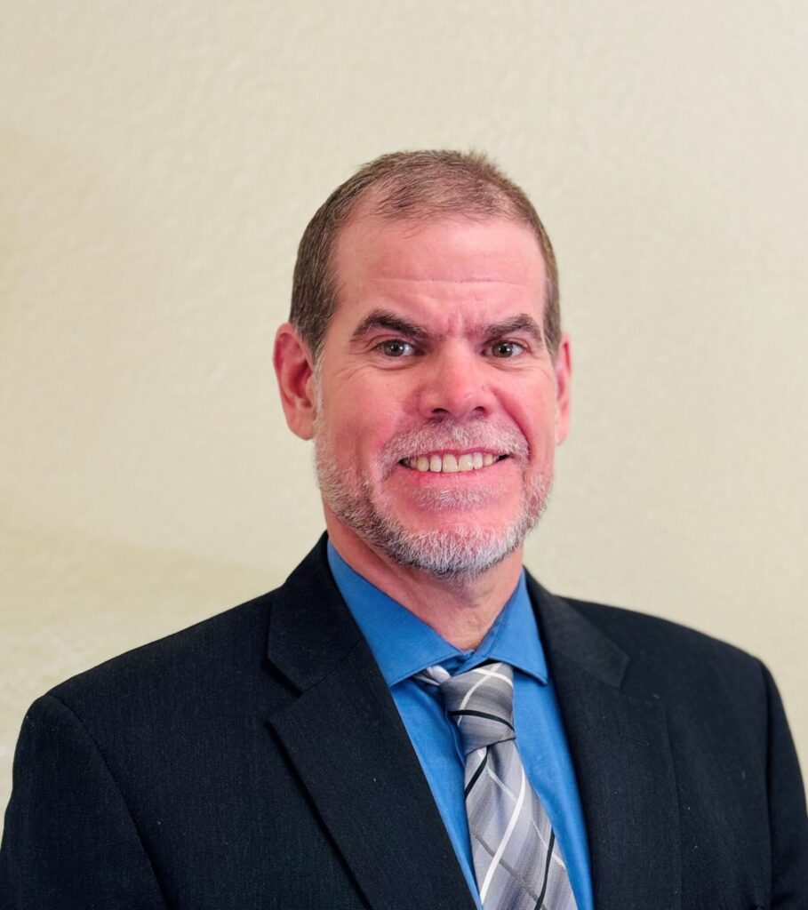 Professional headshot of City Manager finalist Doug Russell