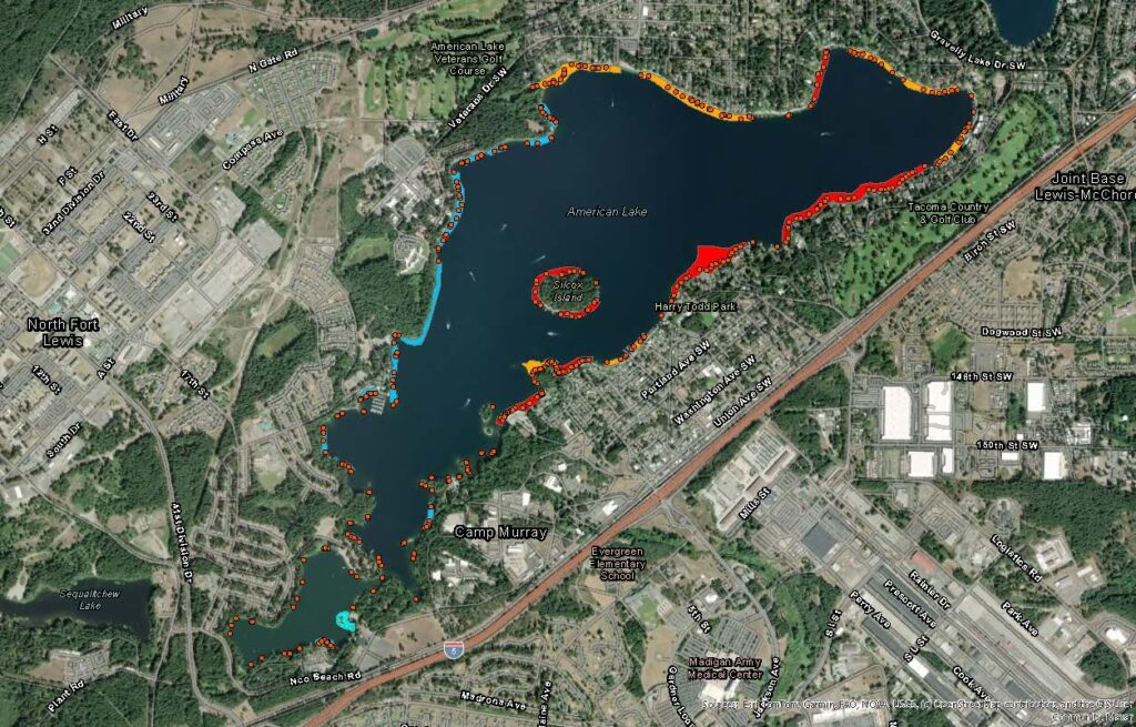 An aerial view of American Lake with red dots around the shoreline where Milfoil treatment will occur on Tuesday, July 8.