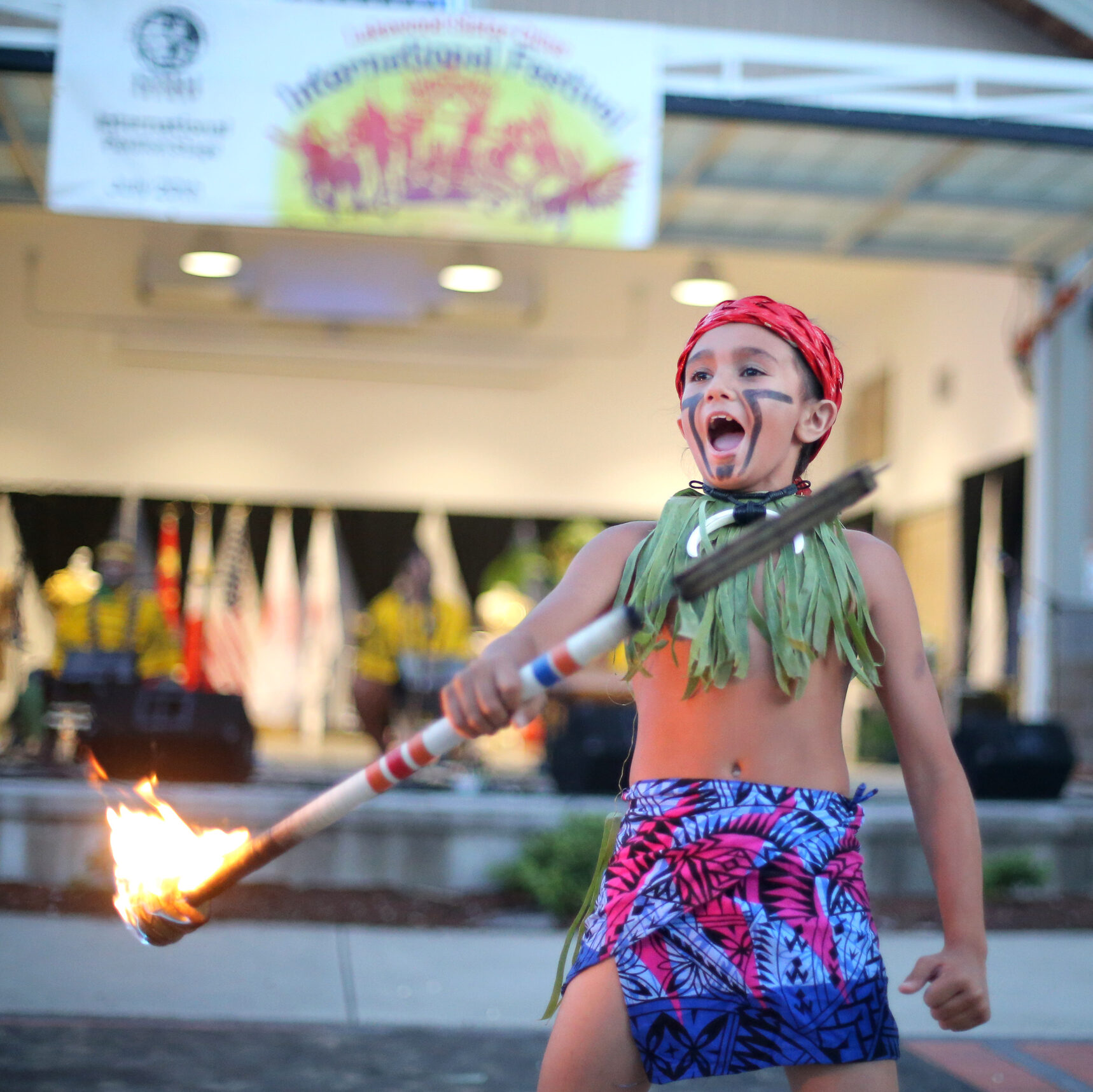 A young fire dancer performs at SummerFEST 2024