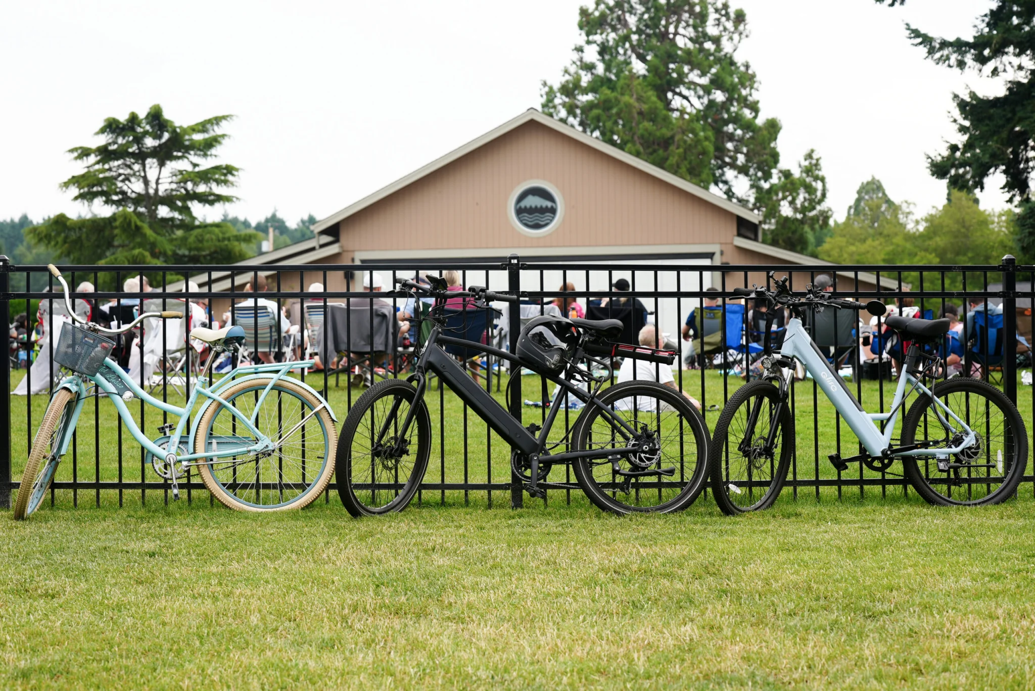 Three bikes leaned against a fence with the Lakewood Pavilion in the background.